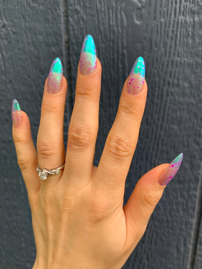 LOCAL BIRDS ERUPTING INTO HOOTENANNY AT THE SPIT OF SPRING SPRINKLERS